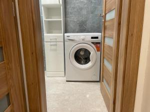 a washer and dryer in a small room at Príjemný apartmán Trnava in Trnava