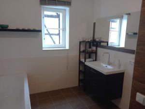 a bathroom with a sink and a mirror at Jagdschloss Friedrichsthal in Waldeck