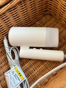 a white cord plugged into a wicker basket at 若葉コーポ103 in Fukuoka