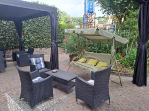 a tent with chairs and a bed and a table at Florivana Boutique Hotel in San Pietro in Cariano