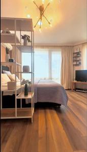 a bedroom with a bed and a ceiling fan at Emerald Breeze Studio in Hotel SPA Resort Emerald in Ravda