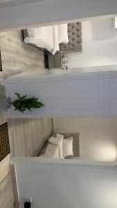 two views of a white room with a bed at شقة بالكامل حي المعذر 2 in Riyadh +2 photos