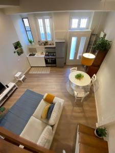 a living room with a couch and a table at La Casa di Paola in Lomagna