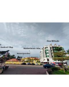 a picture of a street with a building on the side at OMAR BB STUDIO in Kota Bharu
