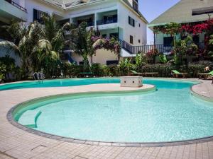 a large swimming pool in front of a building at Leme Bedje - By Bobbywashere in Santa Maria +290 photos