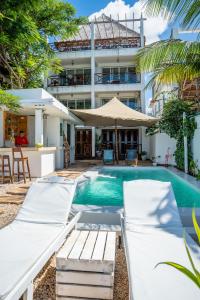 a swimming pool in front of a building at ZAN Sun Beach in Makunduchi