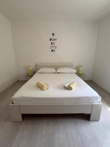 a bedroom with a bed with two pillows on it at NEW Apartment Ema II in Vrh