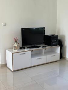 a white entertainment center with a flat screen tv on it at NEW Apartment Ema II in Vrh