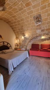 Ένα ή περισσότερα κρεβάτια σε δωμάτιο στο Casa vacanza storica