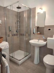 a bathroom with a shower and a sink at Casa Via Roma in Siculiana