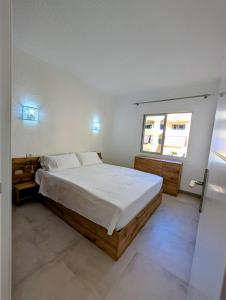 a bedroom with a large bed and a window at Los Cristianos Sun and Relax in Tenerife
