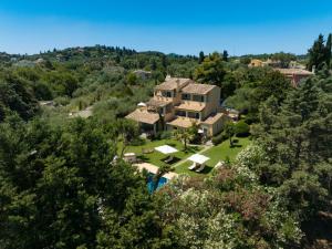 an aerial view of a house with trees at Isabella Country House in Gouvia