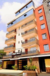 a tall building with balconies on the side of it at Bijou Hotel in Nairobi