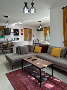 a living room with a couch and a coffee table at Castello Marmaris Holiday Home in Marmaris