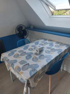 a table with a box on top of it at Studio 5 proche du port in Cancale +4 photos