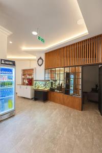 a grocery store with a drink cooler in a room at Ferah Otel in Gebze