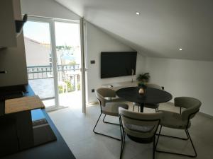 Et tv og/eller underholdning på Top Apartments & Studios Marina View