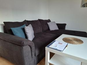 a living room with a couch and a table at Nelke63 in Nordhorn