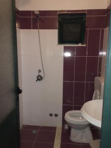 a bathroom with a toilet and a sink at Kompleksi Turistik EDIR in Orikum +291 photos