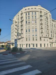 a large white building on the corner of a street at Apartment Antonia - Gevgelija in Gevgelija