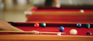 a person playing a game of pool on a pool table at Hot Springs Piscinas 24horas - Central de Reservas in Caldas Novas +58 photos