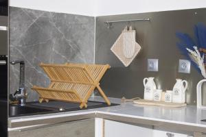 a kitchen with a sink and a counter top at Castel Room in Pont-du-Château
