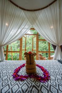 Ένα ή περισσότερα κρεβάτια σε δωμάτιο στο Lazy Coconut Bali +26 φωτογραφίες