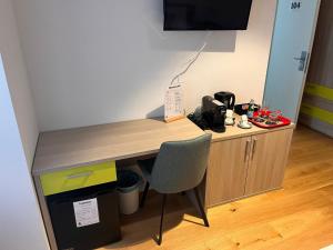a desk with a chair in a room at Terra Buona Rooms in Traona +102 photos