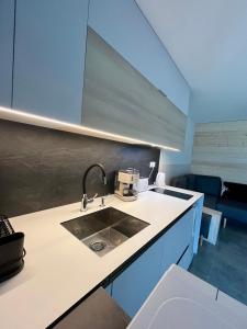 a kitchen with a sink and a counter top at Hacienda Dedinky B in Dedinky