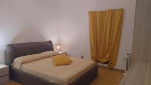 Ένα ή περισσότερα κρεβάτια σε δωμάτιο στο La Casa dei Nonni