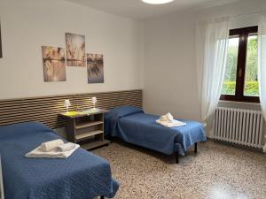 Postel nebo postele na pokoji v ubytování Rosemary House