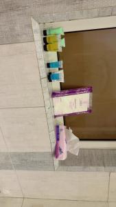 a pile of toothbrushes and toilet paper on a wall at المنزل الآمن in Medina