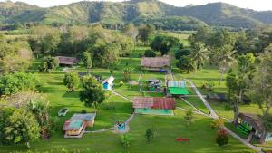 an aerial view of a resort with mountains in the background at 4 Pohon - Les 4 Arbres in Pandang
