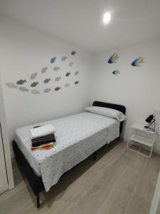 En eller flere senge i et værelse på Apartamento Bellaluz 0505 Resort Golf La Manga Club