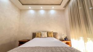 a bedroom with a bed and a window at Harmony Apartment 2 in Bar