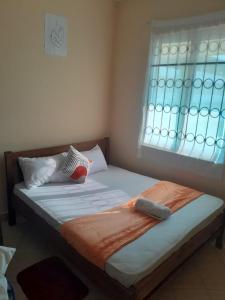Katil atau katil-katil dalam bilik di Cozy escape in Diani darad