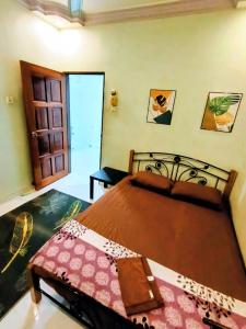 Postel nebo postele na pokoji v ubytování Homestay No. 8