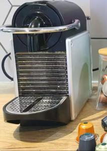 a coffee maker sitting on top of a counter at Appartement atypique et fraîchement rénové in Saint-Vallier