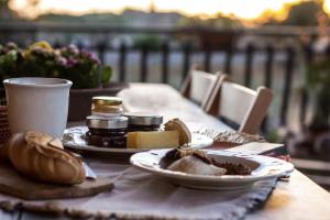 a table with two plates of food on a table at Ariabbona in Modica +20 photos