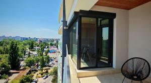 a balcony with a view of a city at Onix Studio Infinity 801 in Văleni