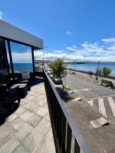 a view of the beach and the ocean from a building at Casa do Horizonte in Ribeira Grande