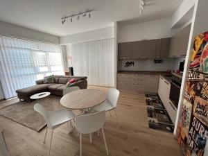 a living room with a table and a couch at BeB Loft Corigliano Rossano CS in Rossano Stazione