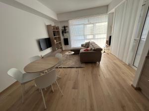 a living room with a table and a couch at BeB Loft Corigliano Rossano CS in Rossano Stazione