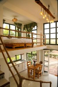 a room with a bunk bed and a table at Farmhouse Loft Apartment at Mogador Essaouira 