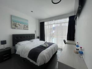 Postel nebo postele na pokoji v ubytování Hotel Oti