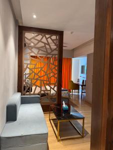 a living room with a couch and a table at Galaxy blue sapphire plaza in Ghaziabad