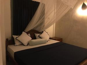 Ένα ή περισσότερα κρεβάτια σε δωμάτιο στο Sajee Eco Lodge