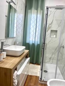 a bathroom with a sink and a shower at Dodi's house in Pozzuoli