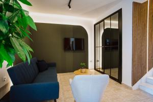 a living room with a couch and a table at Artelo - Inspired Stay in Bitola