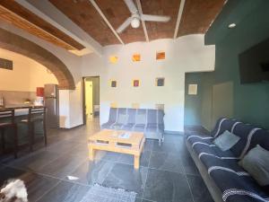 a living room with a couch and a table at Apartamento Parota # in Sayulita